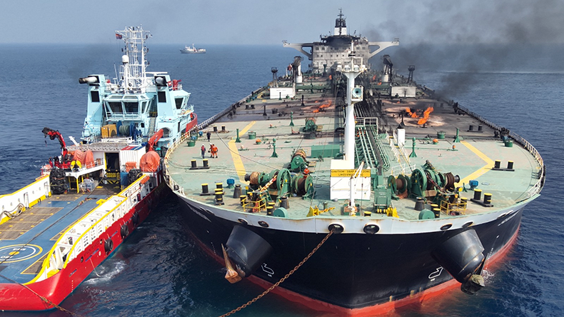 Sounion tanker smouldering with tug, oil removed