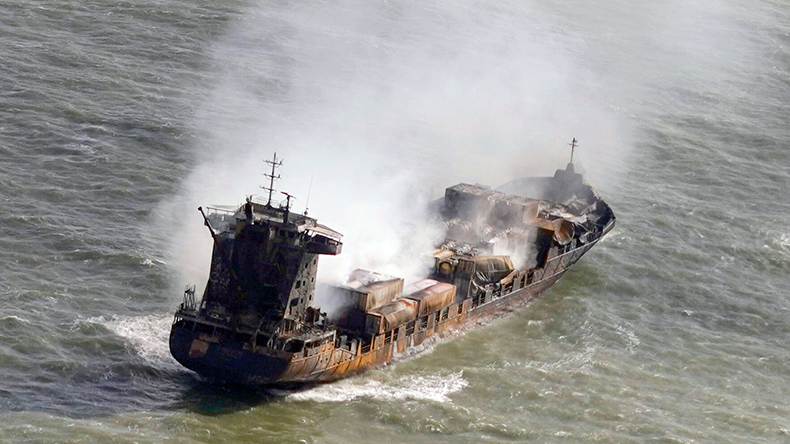 Tugs shadow Solong containership as it drifts in the Humber Estuary