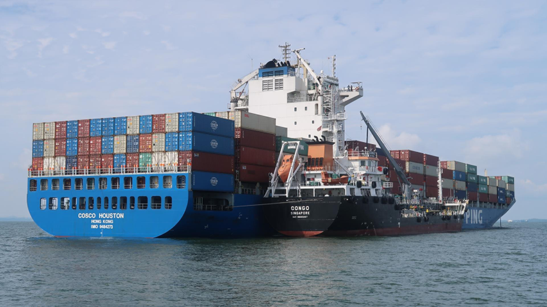 A bunker ship fuelling Cosco Houston off Singapore with biofuel.