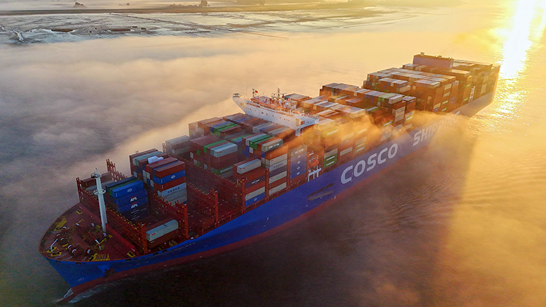 Cosco Shipping Galaxy emerging from the mist with sunbeams
