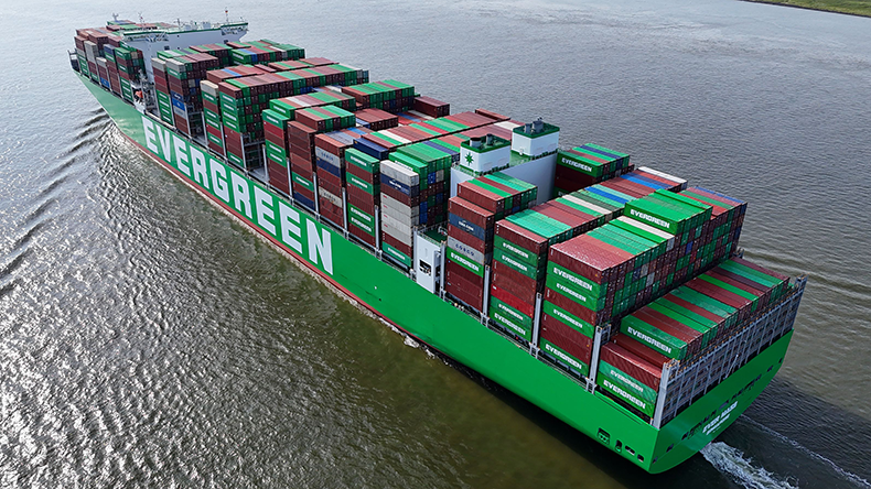 Aerial view of containership Ever Mass on a river