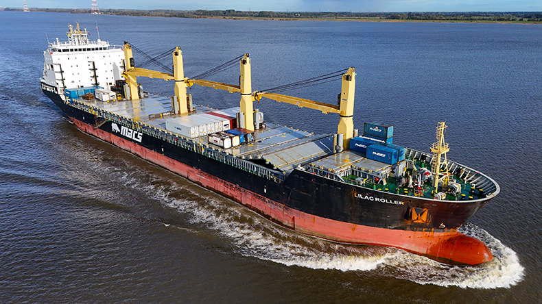 General cargoship with container capacity Lilac Roller heading out on a sunny day