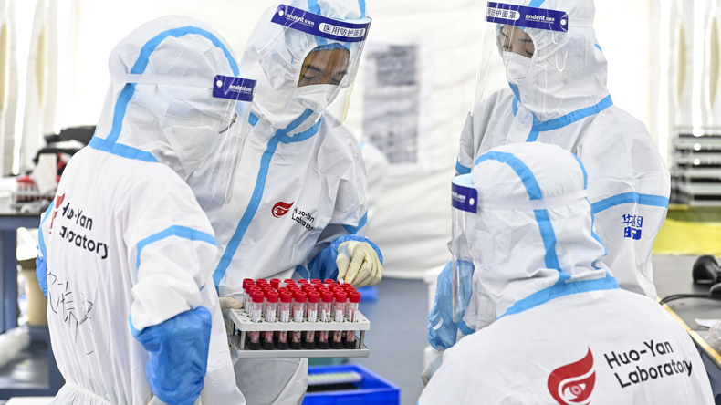 Covid-19 testing at laboratory in southern China. Credit Sipa US / Alamy Stock Photo