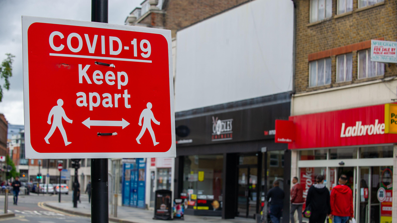 Covid precautions sign in UK town