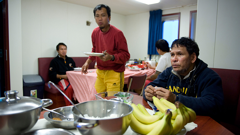Crew on containership eating a meal