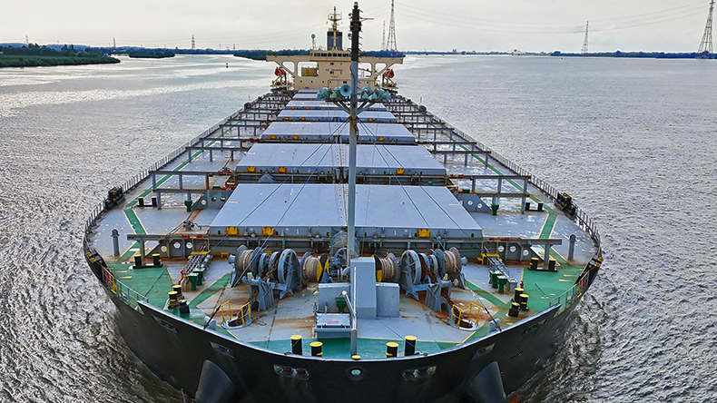 Mini-capesize dry bulker on a river