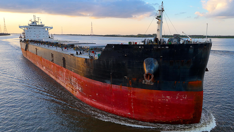 Panamax dry bulk ship on a canal