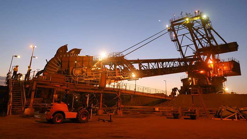 Reclaimer wheel bucket at early morning construction mine site Pilbara region Perth, Australia
