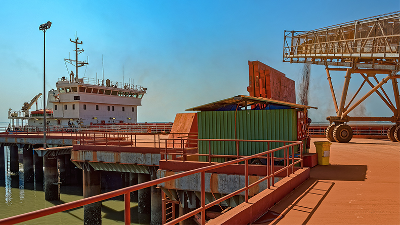 Bauxite aluminum ore loading into a capesize bulk carrier at Guinea, West Africa