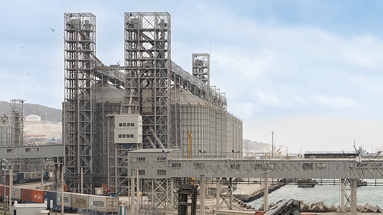 Grain terminal close-up. Railroad cars in foreground. Novorossiysk, Russia