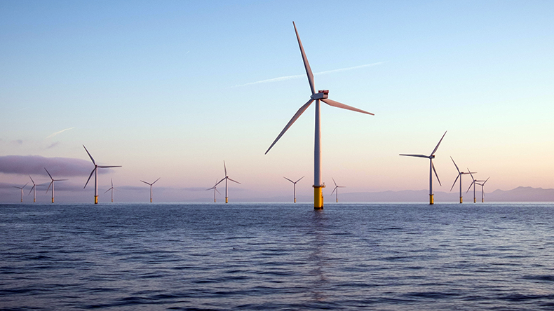 Offshore wind turbines at dawn in the Irish Sea, UK