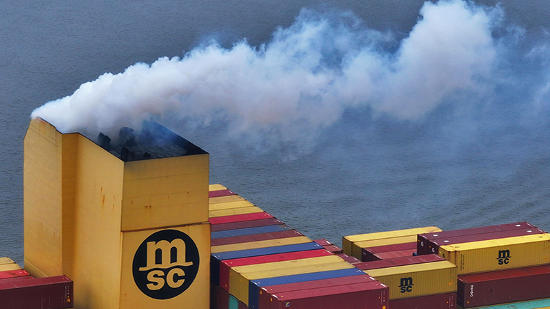 Scrubber on MSC containership funnel with white smoke