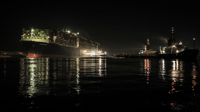 Tugs working to free Ever Given in the early hours of March 29. Credit dpa picture alliance/Alamy Live News