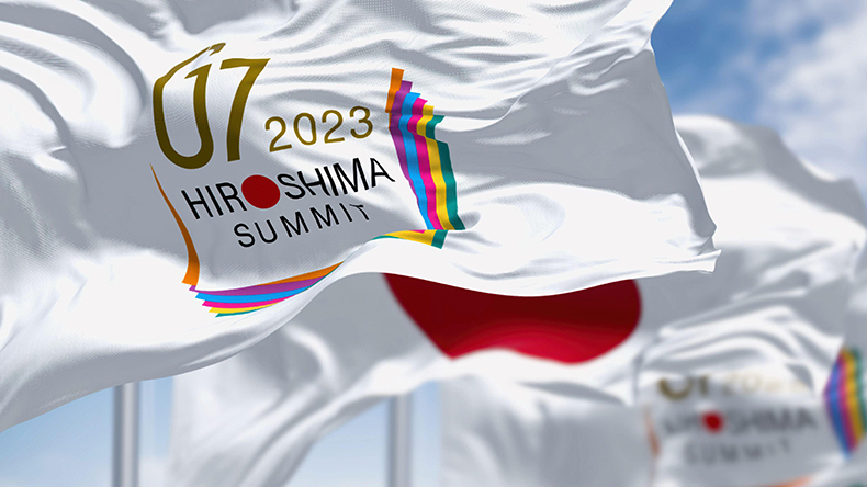 Flags of G7 Hiroshima 2023 summit and the national flag of Japan waving
