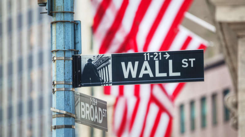 new wall street sign with american flag