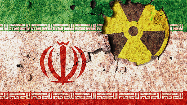 Iran flag on a wall. Conflict of atomic technology