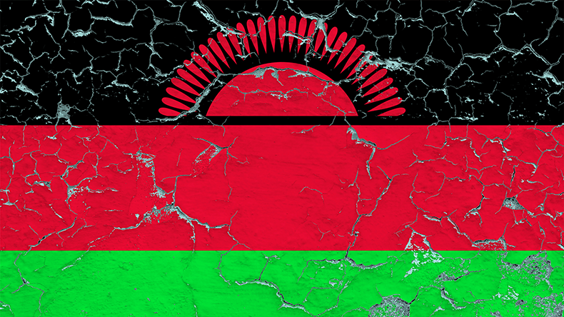 Flag of Malawi painted on cracked dirty wall. National pattern on vintage style surface