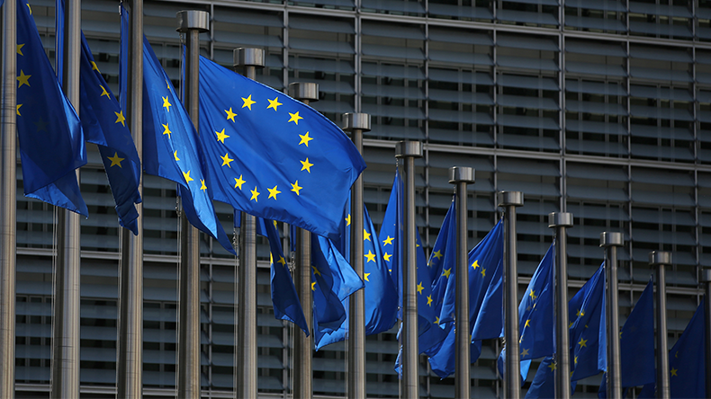 European Union flags fly outside the Berlaymont building, which houses the headquarters of the European Commission, in Brussels, Belgium