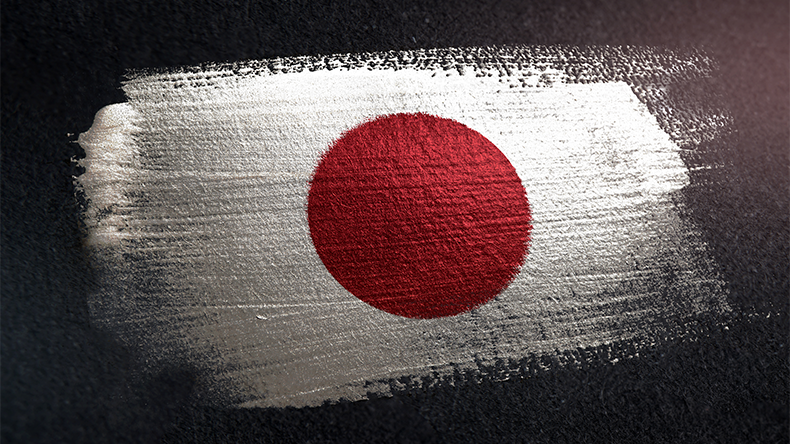 Japan Flag Made of Metallic Brush Paint on Grunge Dark Wall