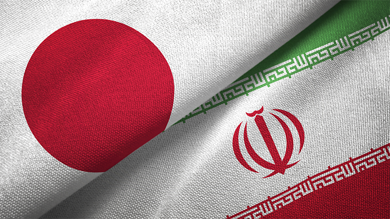 Japan and Iran flags on  textured background
