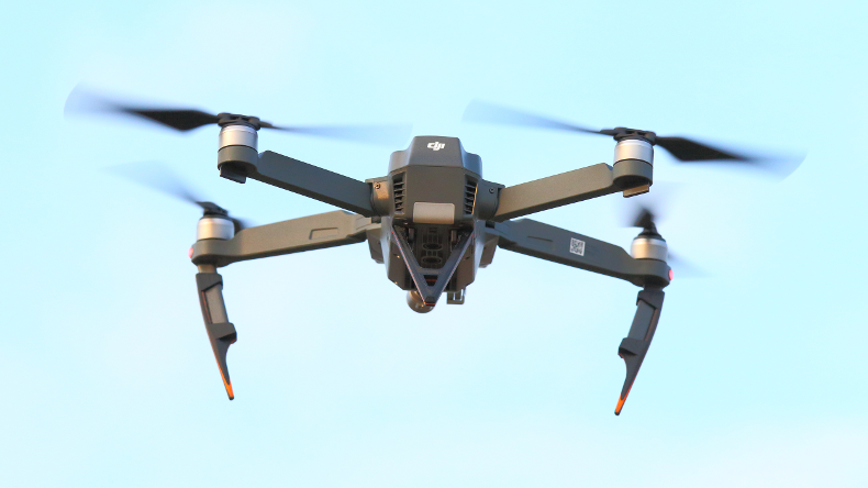 Drone flying in blue sky