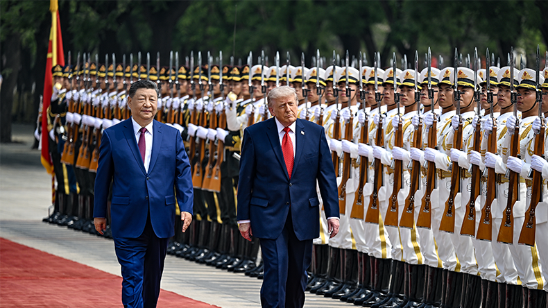 US President Donald Trump reviews an honor guard with Chinese President Xi Jinping during a welcome ceremony at the Great Hall of the People in Beijing, China