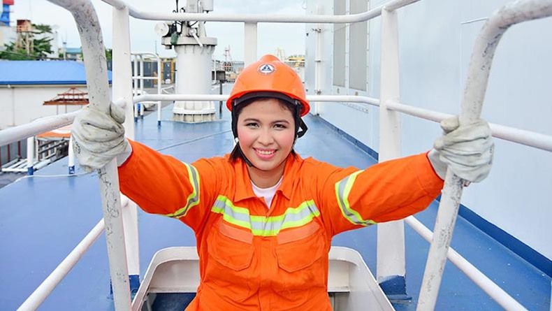 Woman seafarer on ladder