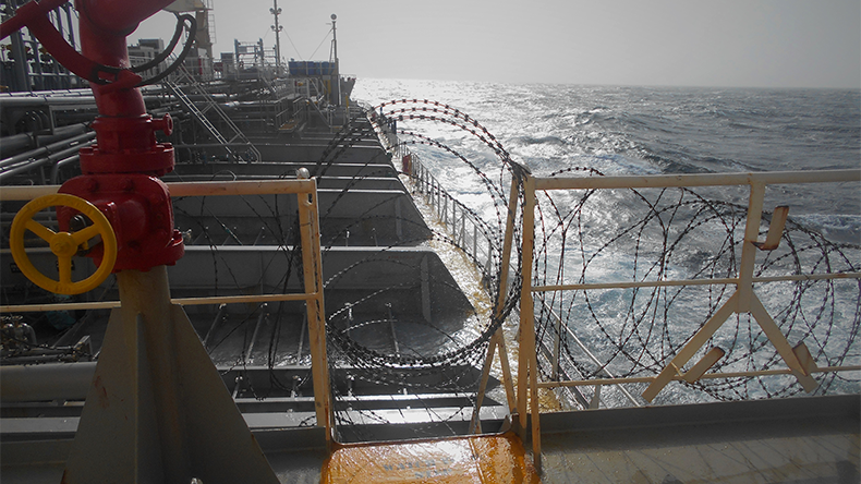 Onboard ships using razor wire to stop pirates from boarding the ship. These ship protection measures are employed when a ship passes through high-risk areas.