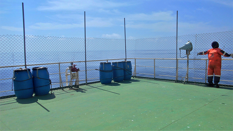 View of the vessel hardening on board ships using wire fencing, mannequin and water drums to prevent and and cover the ship and personnel from pirate attack