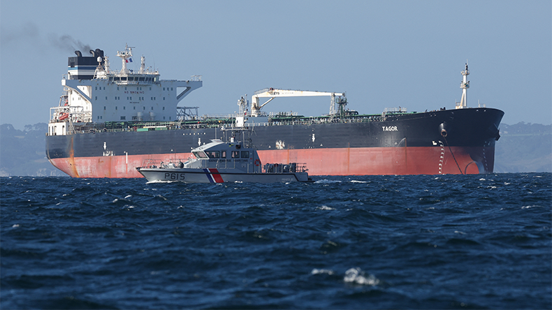 French Navy vessel sails by the Russian oil tanker "Tagor", suspected of flying a false Cameroonian flag and boarded by the French Navy on May 31, 2026, as it arrives in Douarnenez Bay