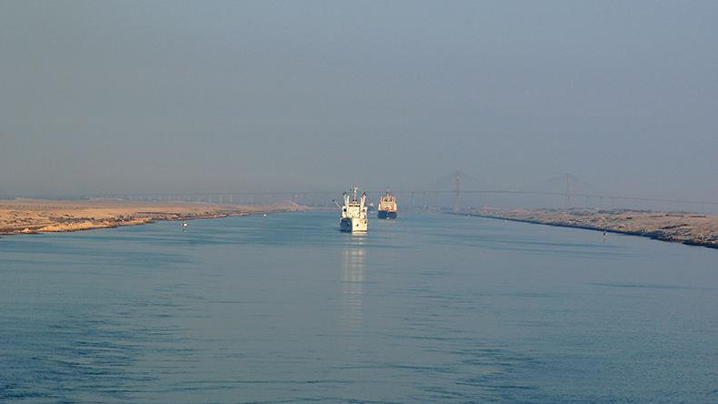 Suez Canal bridge two boats horizon