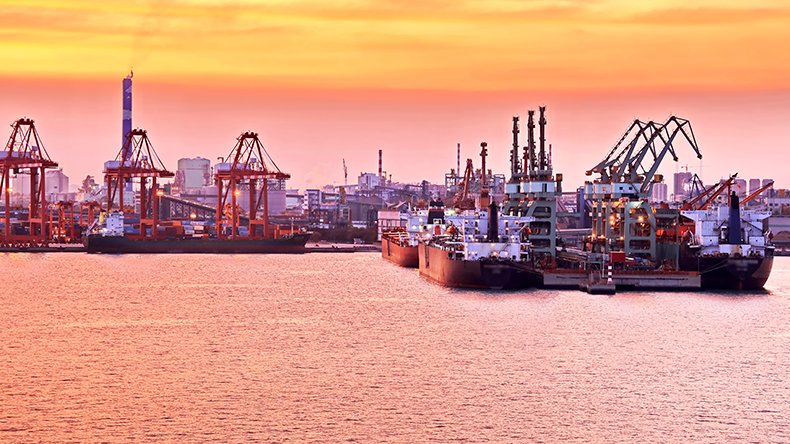Panoramic night views of piers, sea vessels, tugboats and the city of Rizhao, China.
