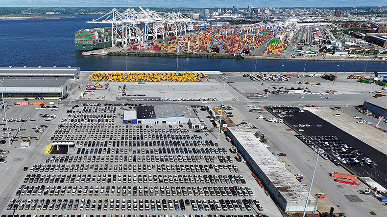 Aerial view, automobiles are parked at the Port of Baltimore's import lot on May 7, 2025 in Baltimore, Maryland