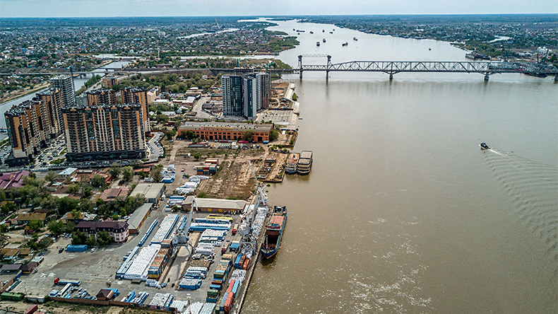 An aerial view taken on May 5, 2021 shows a railway bridge over the Volga river and a port in the city of Astrakhan