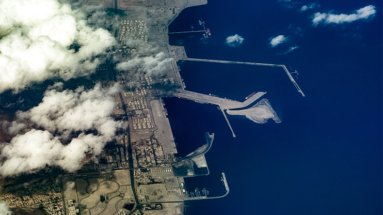 Aerial landscape view of coastline in Fujairah, located at Gulf of Oman, with Port of Fujairah, Fujairah Oil Industry Zone