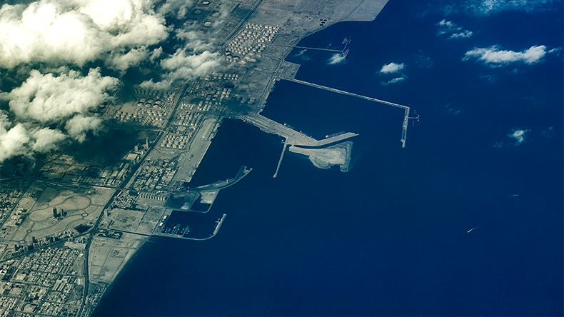 Aerial landscape view of coastline in Fujairah, located at Gulf of Oman, with Port of Fujairah, Fujairah Oil Industry Zone