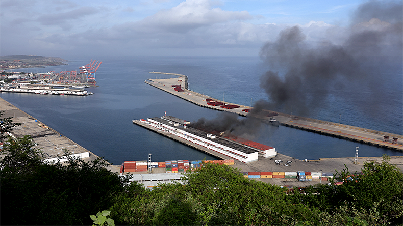  Smoke rises from Port of La Guaira after explosions and low-flying aircraft were heard on January 03, 2026 in La Guaira, Venezuela