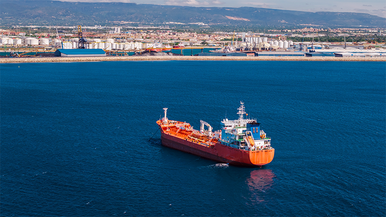 Aerial view of chemical tanker ship near industrial port coastline in Tarragona Spain