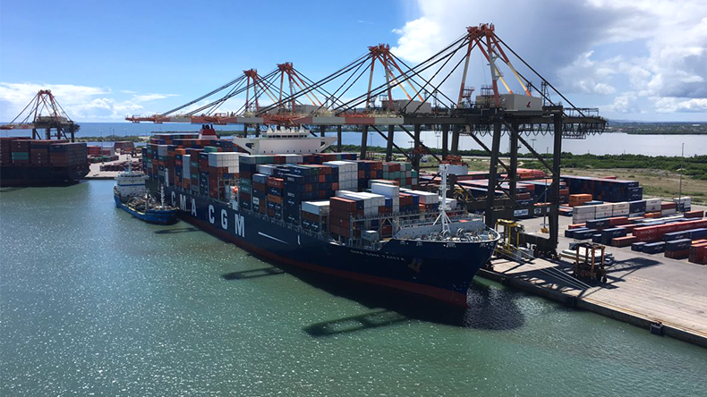 Kingston Freeport Terminal prt on a sunny day with a ship being unloaded