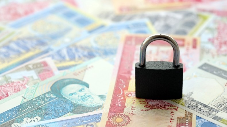 Padlock on Iranian currency Iran sanctions Adobe Stock mehaniq41 790x444