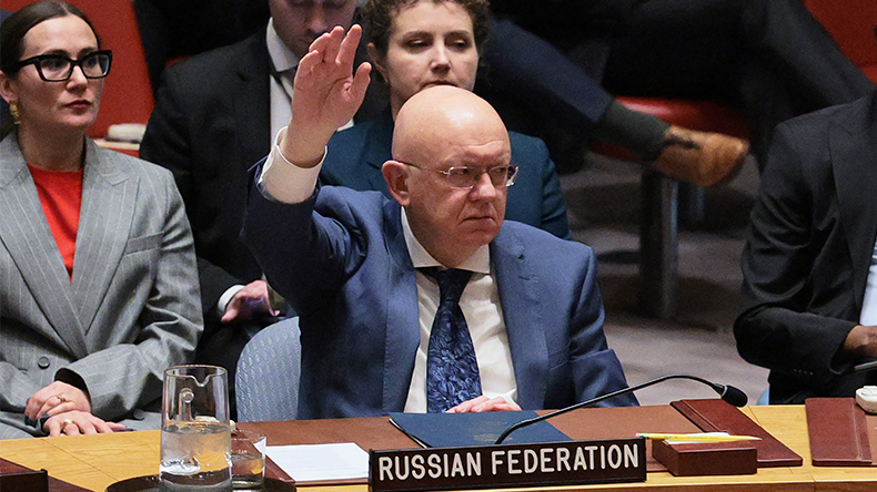  Ambassador Vassily Nebenzia, Permanent Representative of the Russian Federation to the UN, votes "No" on a draft resolution during a United Nations Security Council meeting regarding the situation in the Middle East