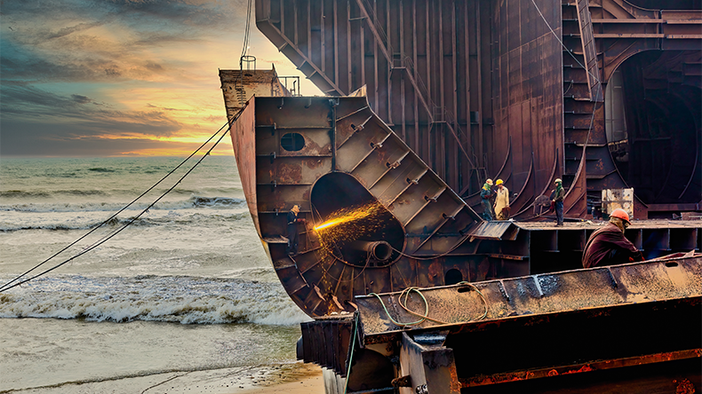 Shipbreaking of a large oil tanker in the harbour, Gadani ship breaking yard, Pakistan