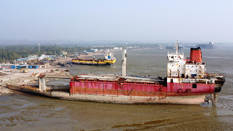 Inside of ship breaking yard Chittagong, Bangladesh. Workers at the ship breaking yard are busy cutting up old ships