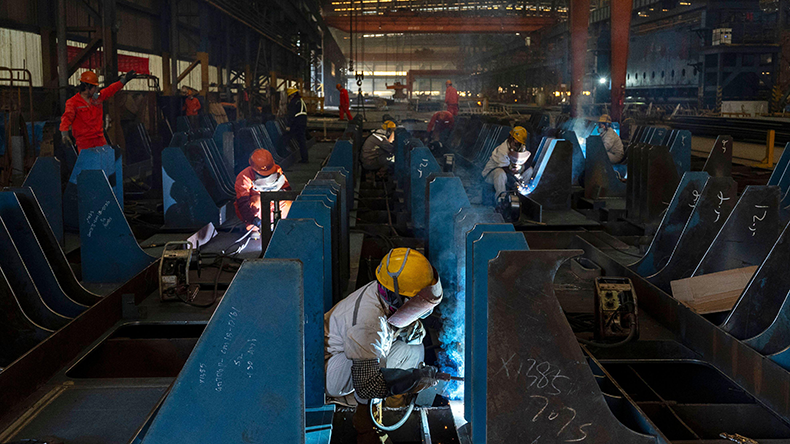 Workers welding in a workshop of Jiangsu Yangzi Xinfu Shipbuilding