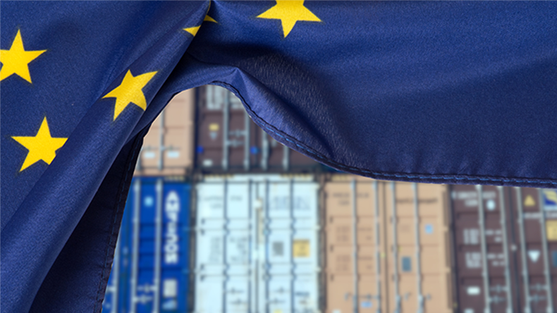 EU flag with container stack in background