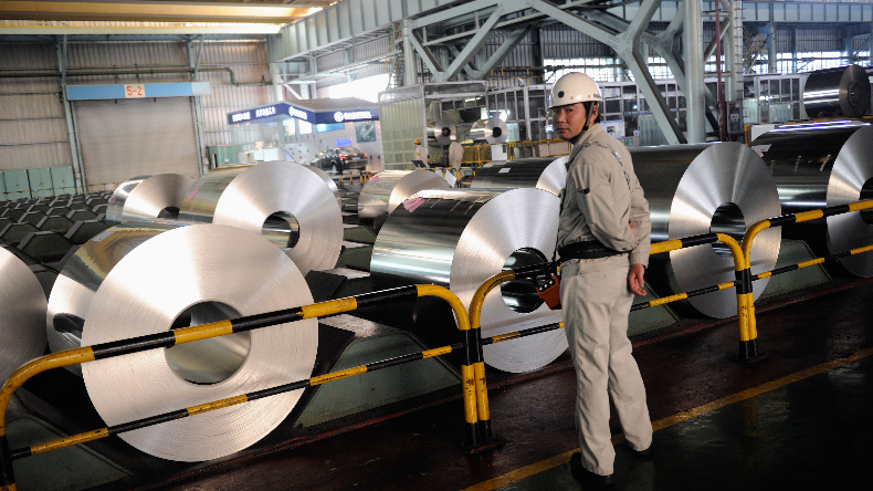 China steel factory of Baosteel worker with steel rolls