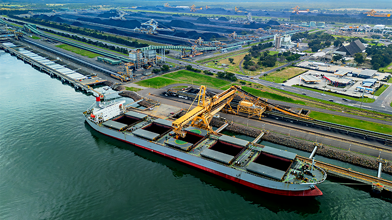 Aerial view of a coal vessel loading at a port in Australia