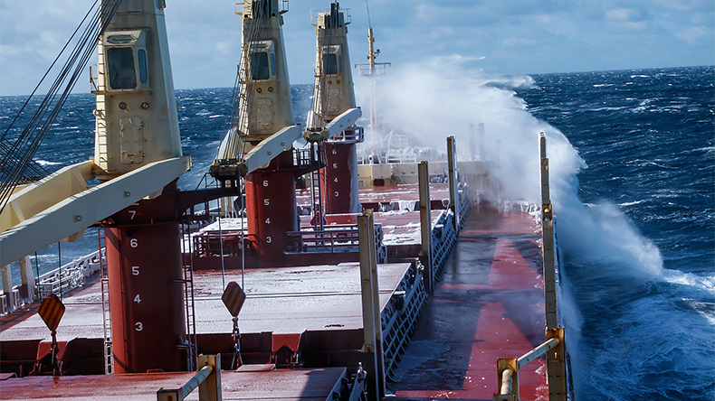 Bulk carrier sailing in very cold waters with storms
