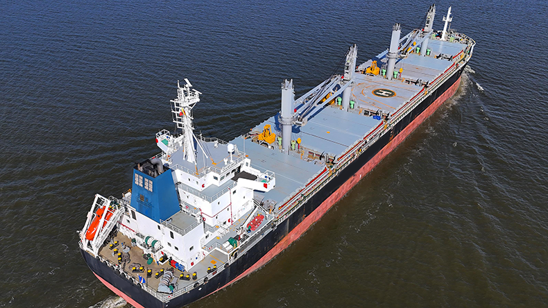 Dry bulk ship on canal near port