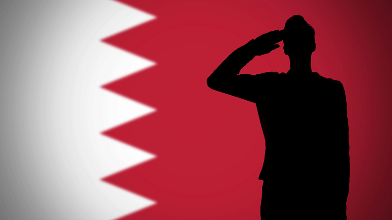Silhouette of a soldier saluting against the Bahrain flag